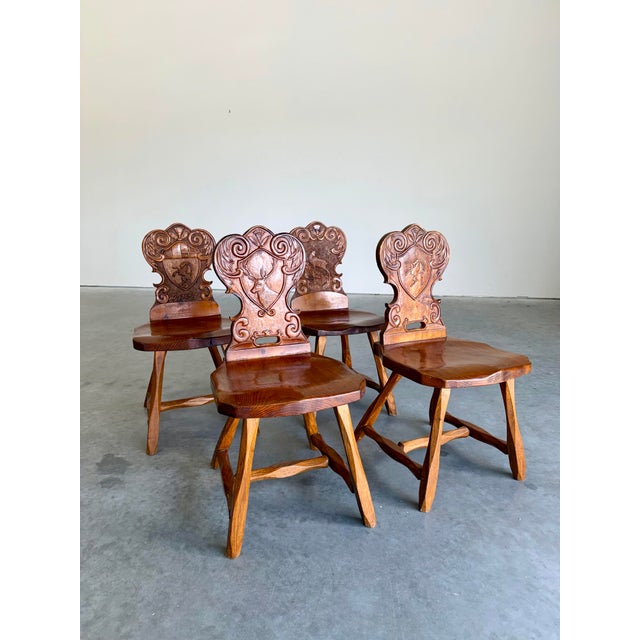 Vintage Brutalist Pine German Swiss Alpine Folk Art Tyrolean Hand Carved Dining Chairs. Pegged joints and detailed carved...