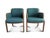 A pair of Thonet bentwood club chairs. The modern armchairs are a dark oak with a unique bentwood frame and green...