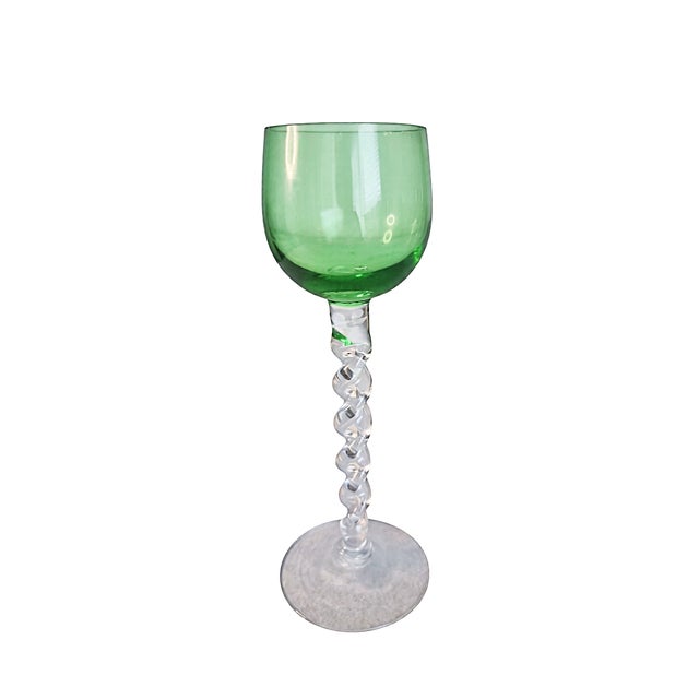 This is a vintage harlequin set of mid-century cordial or aperitif glasses featuring colored bowls and clear twisted glass...