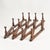 Beautiful, expertly crafted, dark wood antique accordion peg rack. Each peg is tipped with a white glass or porcelain...