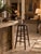 This is an antique wooden stool. The tall wood stool features turned legs with a beautiful curved splay. Rich warm tone...