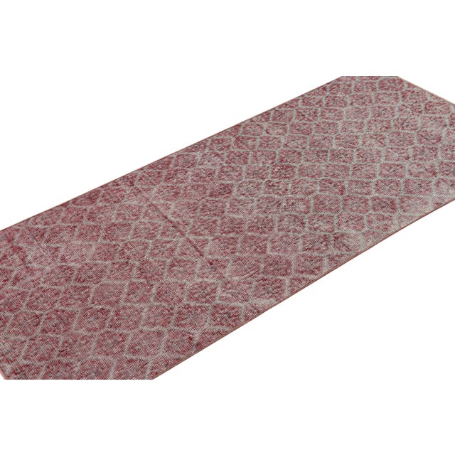 Handknotted in wool, this 3x6 vintage runner rug originates from Turkey, circa 1960-1970, and is believed to be among the...