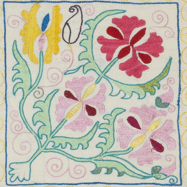 Infuse your home with the rich heritage of Central Asia with this exquisite Hand-Embroidered Suzani Cushion Cover, crafted...