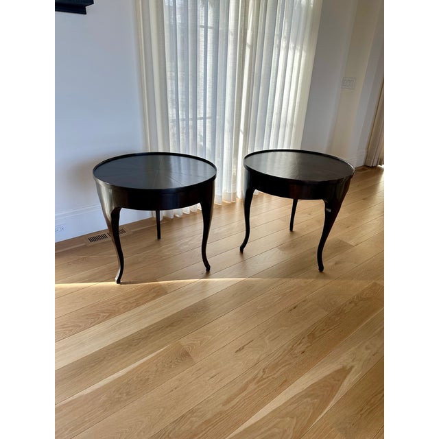 A beautiful pair of Rose Tarlow Tristan side tables (sold separately) in rich walnut, Dimensions: 30" Did x 28.5" H. Side...
