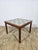 Teak coffee table lined with ceramic tiles. Produced in Denmark in the 1960s. It features authentic Mid Century Modern,...