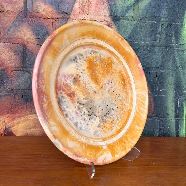 This serving dish was made by clay artist Andy Smith. He was known for creating raku pottery using traditional forms with...