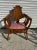 This early 20th century upholstered walnut throne chair showcases masterful craftsmanship, highlighted by its ornate...