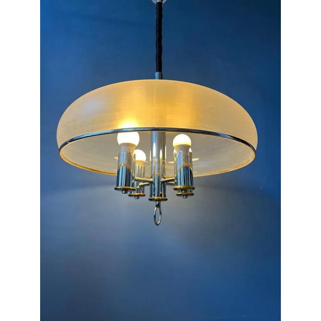 Rare Space Age pendant lamp with acrylic glass outer shade and inner chrome 4-bulb 'chandelier'. The height of the lamp...