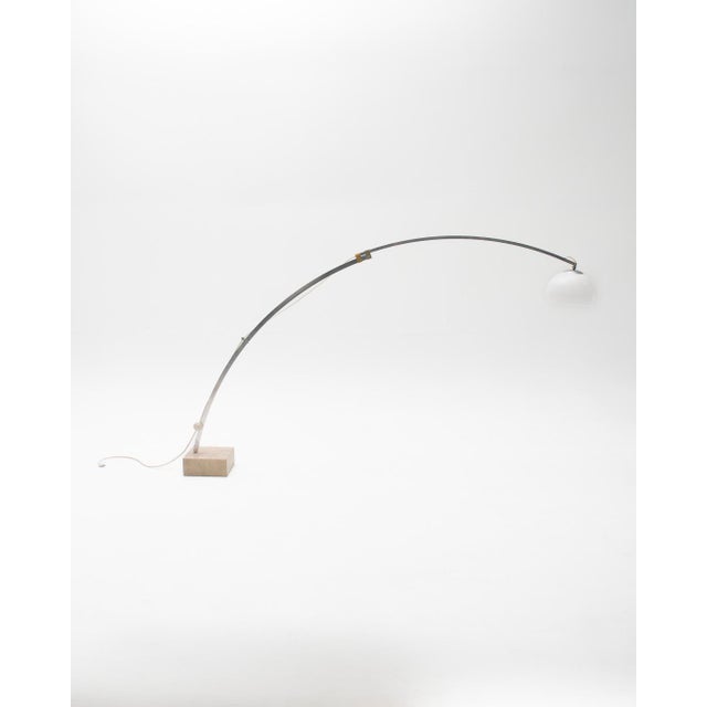 Adjustable mid-century style arc lamp with Italian inspiration from the 1960s. This piece combines an arched metal...