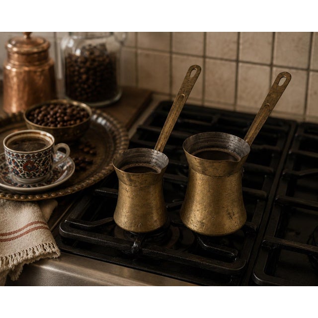 A charming vintage pair of Lebanese brass Turkish / Arabic coffee pots (cezves / ibriks), marked Made in Lebanon and...