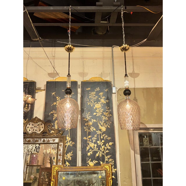 The Murano Pink and Black Glass Pendant Lights are stunning chandeliers perfect for adding a touch of elegance to any...