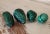 A set of 4 beautiful, natural, solid, and substantial hand carved and polished bright green malachite stones in various...