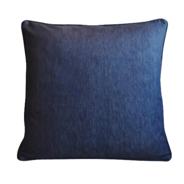 Custom-tailored pillow in an all-cotton lightweight blue denim fabric. Same fabric on the reverse. Custom cord trim....