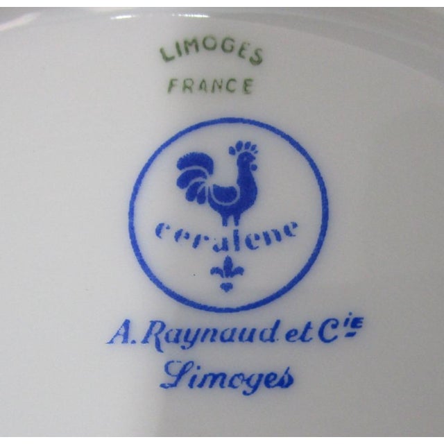 This exquisite porcelain lunch or tea plate by A. Raynaud & C'ie showcases the timeless elegance of Limoges craftsmanship....