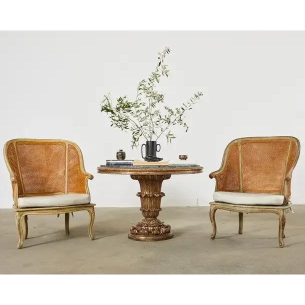 Amazing pair of bergère armchairs custom made by Hendrix Allardyce. The bespoke chairs feature a large gracefully curved...