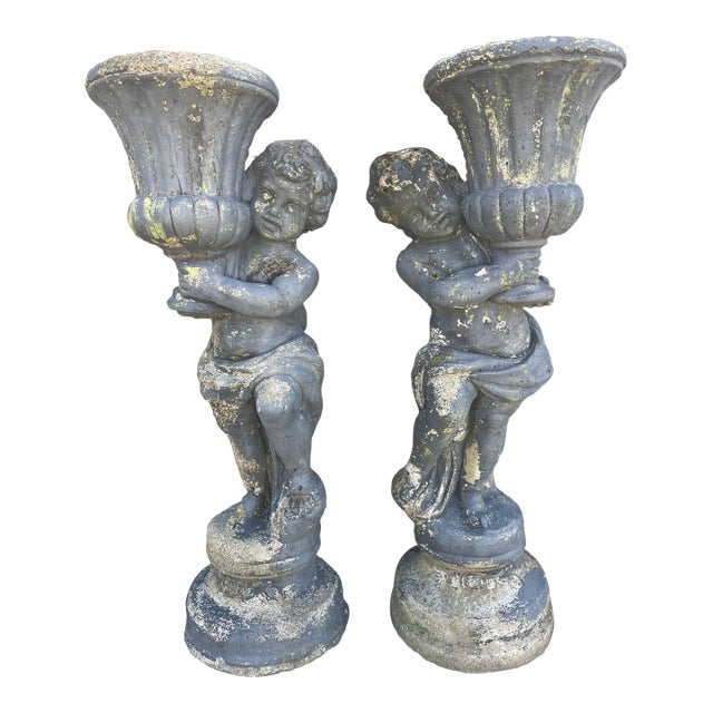 1940s Pair of Grand 39" Tall Neoclassical Cast Stone Putti Figure Planters With Mossy Patina For Sale