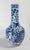 We are selling this well decorated Chinese underglaze Blue and White vase. This vase has simple peony and dragon...