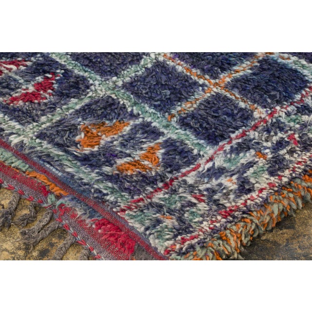 Hand-knotted in wool and originating circa 1950-1959, this 6x11 vintage Moroccan Berber rug joins Rug & Kilim’s Moroccan...