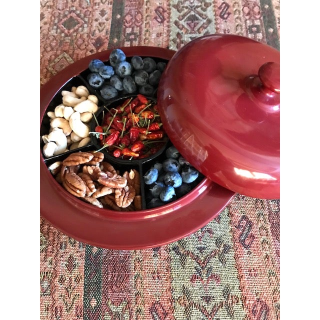 A traditional tea box for pickled tea leaves, lahpet, this vessel with seven sections is equally delightful as a...