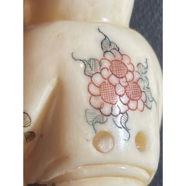 Carved lady Netsuke. Traditional Japanese garment robes had no pockets. Objects in containers (called sagemono) hung by...