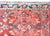 A gorgeous early 20th century Persian Sarouk Mohajeran rug with a large stylized floral central medallion amidst even more...