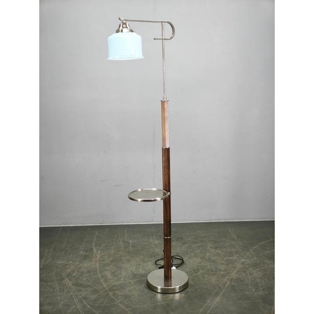 Rare and elegant art deco floor lamp produced in czechoslovakia during the 1930s. This exceptional piece features a...