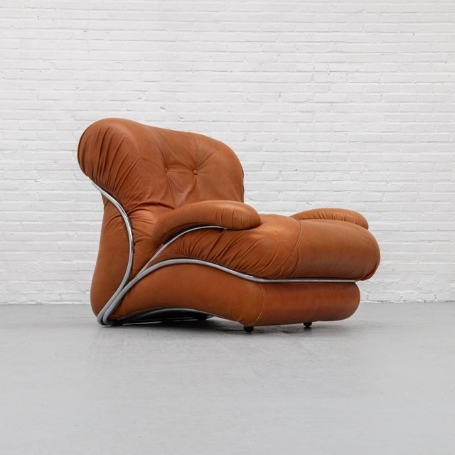 Corolla lounge armchair produced in the 1970s by i.p.e\. A distinctive design with wide, wing-like forms that give the...