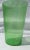 Bright green transparent cylinder vase. Seeded air bubble throughout the body, bright grassy green color with raindrop...