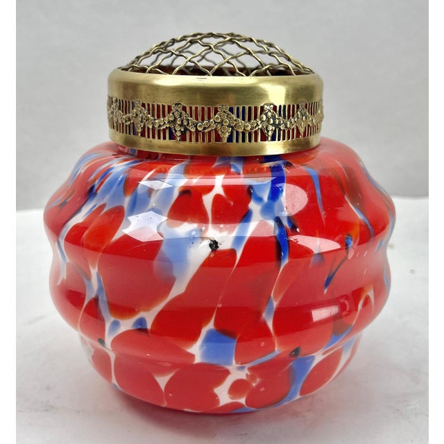 Dramatic multi color decor, cobalt and orange, in hand blown splatter glass vase in the Art Deco style. This design for...