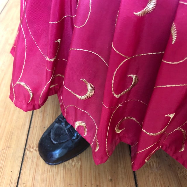 Gorgeous petite red ruffled atop with real wooden feet! Absolutely darling. Perfect for the interior designer.