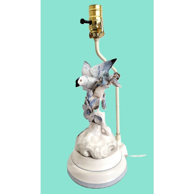 Offering a SMALL vintage porcelain blue bird figurine table lamp, circa 1960s. This pretty hand painted porcelain lamp...