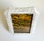 This elegant tabletop picture frame features tessellated mother-of-pearl and a sinuous shape. Crafted using an inlay...