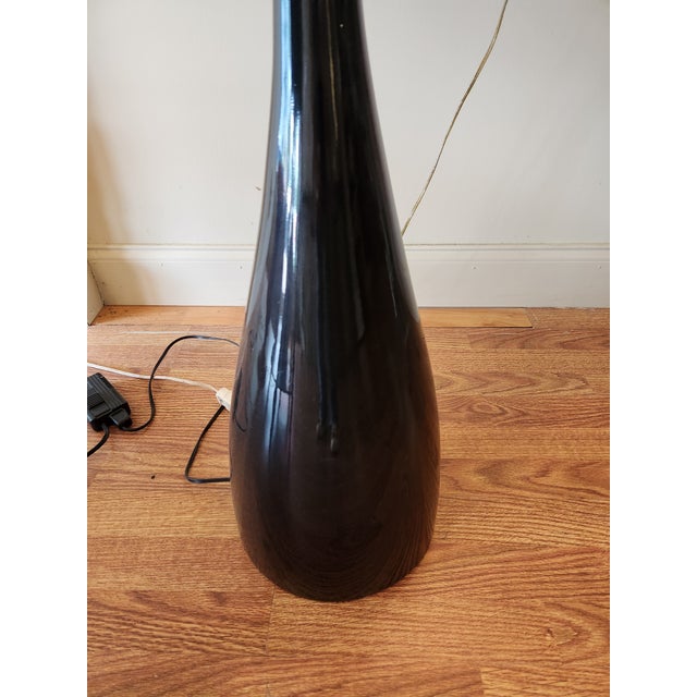 Jazz style floor lamp. It's original style designed by Diego Fortunato. It provides an indirect light (up right) that...