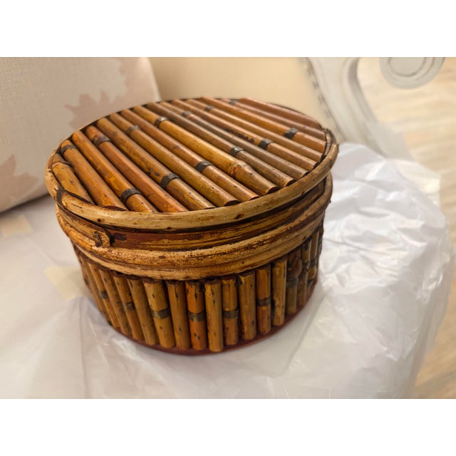 Beautiful vintage nesting boxes crafted from natural bamboo, featuring intricate hand-wrapped detailing and a wonderfully...