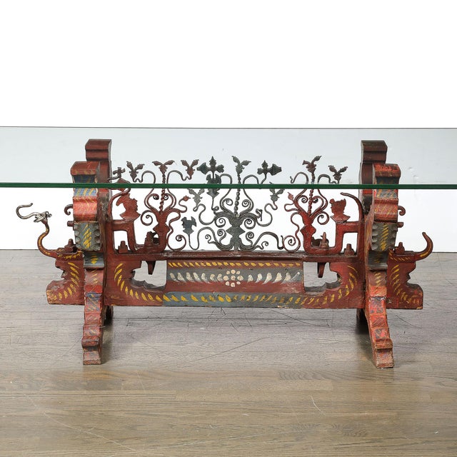 A captivating blend of rural artistry and functional design, this Sicilian polychromed wood and iron oxcart cocktail table...