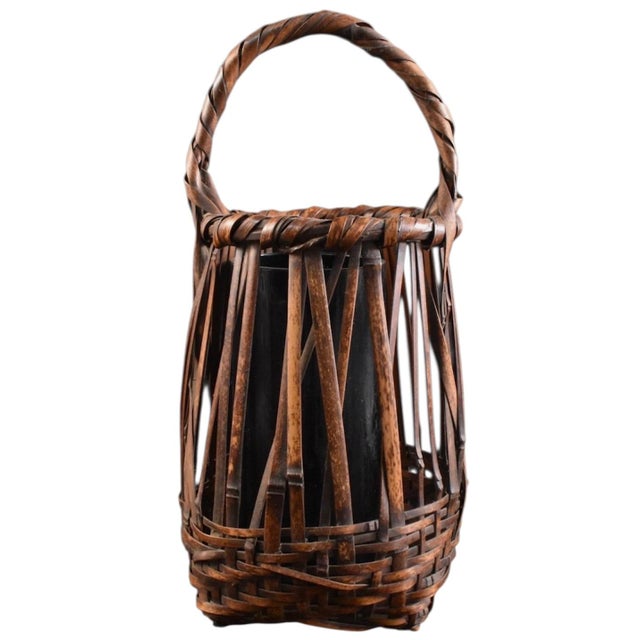 Antique Japanese woven bamboo ikebana basket made from natural 'Hobichiku' *(smoked 'nemagari dake' bamboo) and woven in...