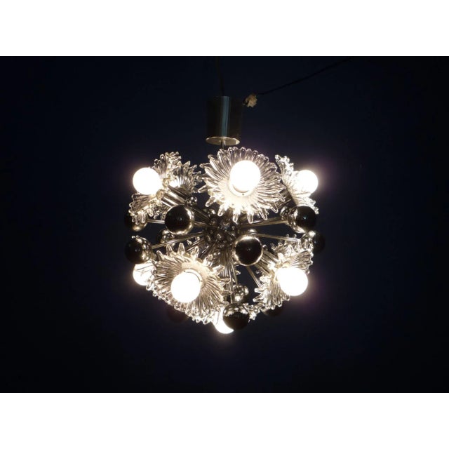 Very nice Sputnik lamp by Cossack. From first owner and fully functional. Very good and authentic original condition....