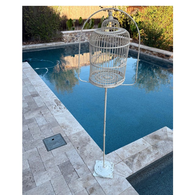 Vintage charm at its finest ️ This tall white birdcage on a stand brings instant cottagecore whimsy and shabby chic style...