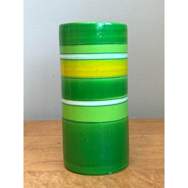 This vibrant cylindrical vase was created in Italy for the renowned importer Rosenthal-Netter, a hallmark of sophisticated...