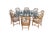 Monumental mid century modern dining table and eight chairs by McGuire Furniture. The table features octagonal form with a...