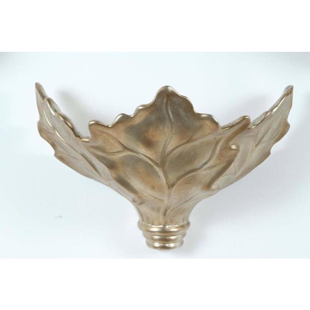 Pair of 1980's Glamorous leaf sconces that have a beautiful antiqued glazed silver leaf finish by Robert Marcius The...