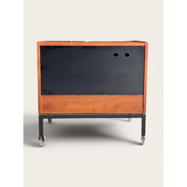 High-quality serving trolley from the mid-century era (circa 1960s). This piece of furniture impresses with its angular,...