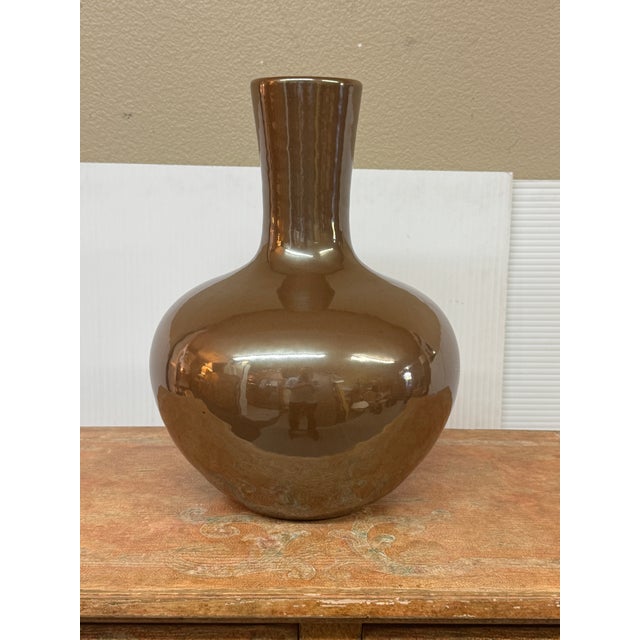 Design Plus Gallery presents a Contemporary Ceramic Bottle Vase from Martino Interiors. The rounded body narrows toward...