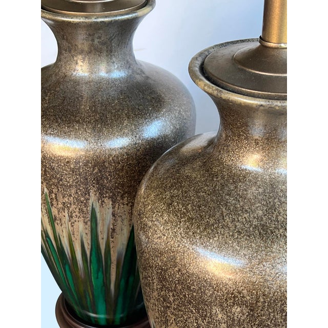 each large baluster-form lamp with a taupe-colored textured iridescent glaze at the shoulder cascading down to a rich...