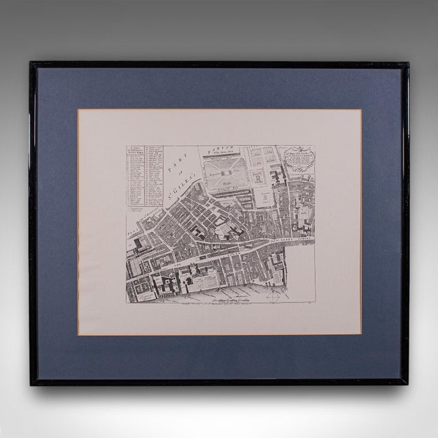 This is a vintage 18th century street map of London. An English, framed reproduction showing the parishes of St Clement's...