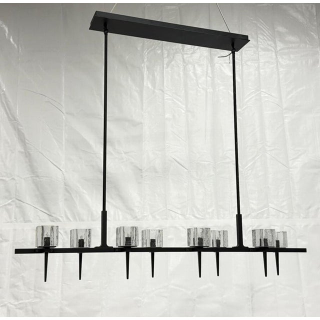 A striking example of contemporary American lighting design, this "Kellen" 8-Light Chandelier was designed and...
