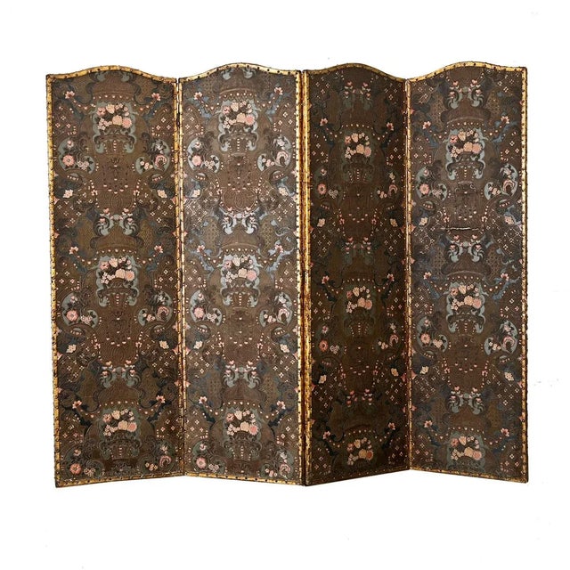 A captivating, Spanish 19th century tooled leather folding screen–over six feet tall–embossed with floral & foliate motifs...