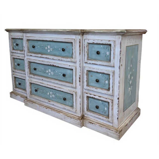A vintage hand-painted Shabby Chic 9-drawer dresser. Painted and distressed in ivory and blue. The matching nightstand...