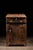 Early American standing desk constructed from wide, rough-sawn wooden boards with a deeply worn dark finish and...