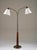 A beautifully crafted swedish modern floor lamp, designed by tor wolfenstein for ditzingers in the 1940s. This elegant...